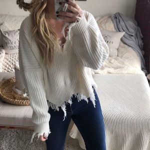Shredded sweater distressed